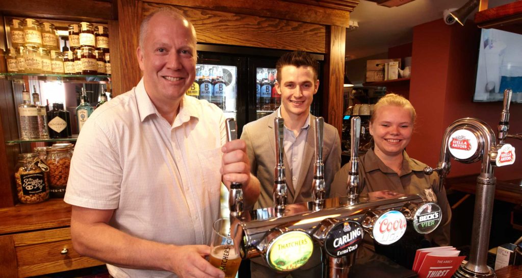 Friendly Staff serving real ale
